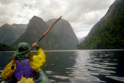 Elvira kayaking in Doubtful Sound, New Zealand